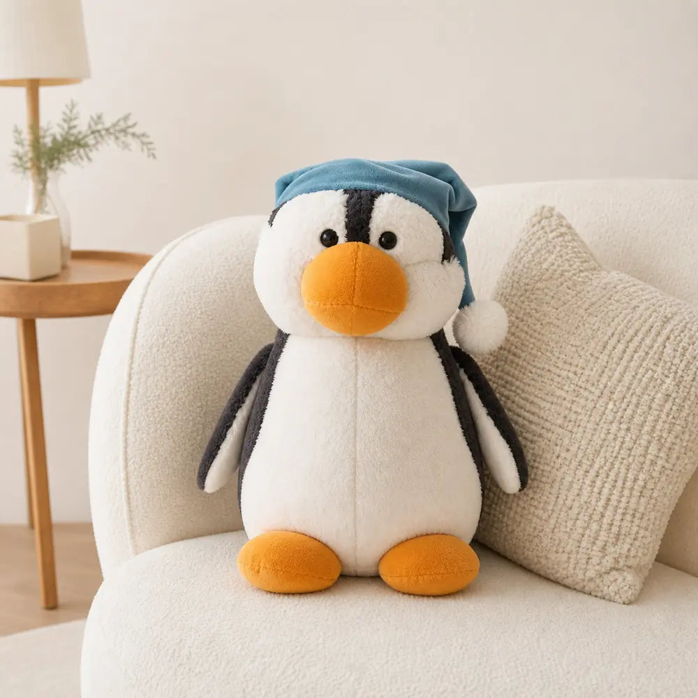 Blue Sleep Cap Penguin Plush Toy on a Cozy Sofa