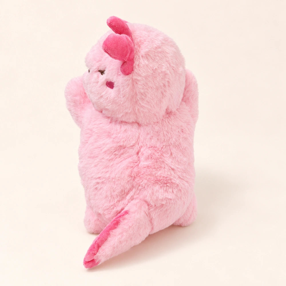 Rear view of the fluffy Sleepy Pink axolotl plush with a darker pink tail fin.