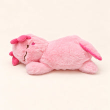 Side view of the Sleepy Pink axolotl plush showing fluffy pink fabric, embroidered facial details, and a pink tail fin.
