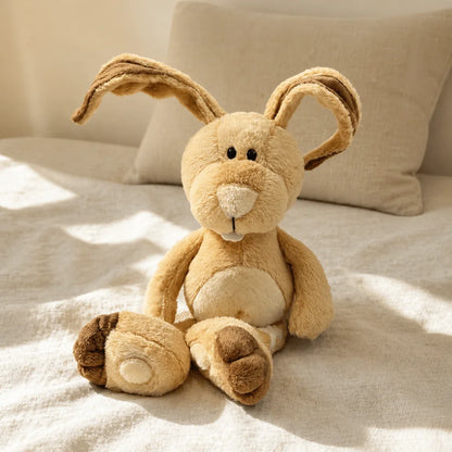 Tan Bunny Plush Toy on Linen Bed