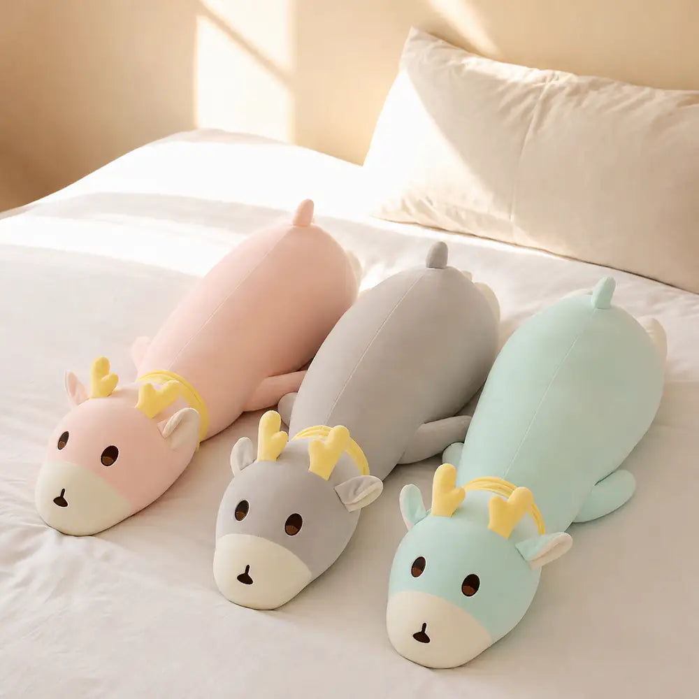 Pink Gray and Mint Long Deer Body Pillow Plush Toys on a Bed