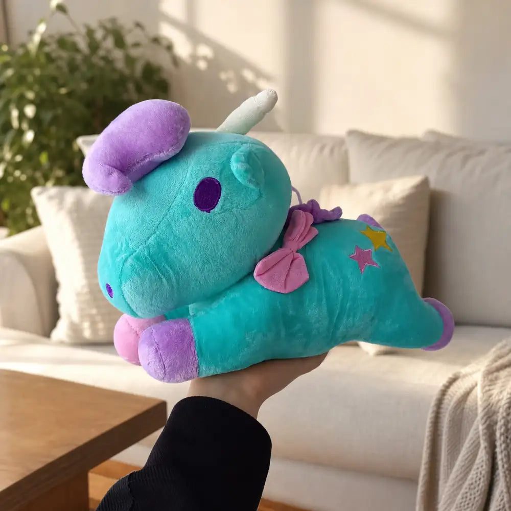 Turquoise pastel unicorn plush toy held in a warm living room