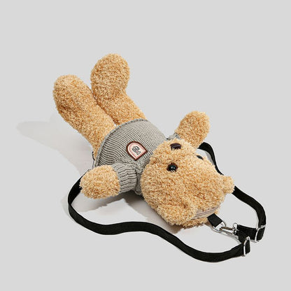 Brown teddy bear backpack wearing a knitted jumper