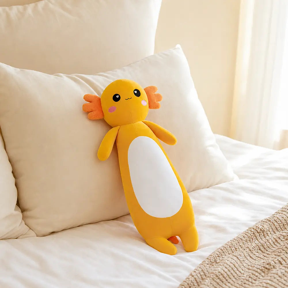 Yellow Long Axolotl Plush Toy on a Cozy Bed