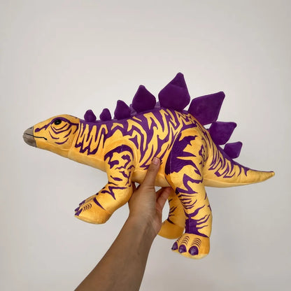 Yellow Purple Stegosaurus Stuffed Animal Held View
